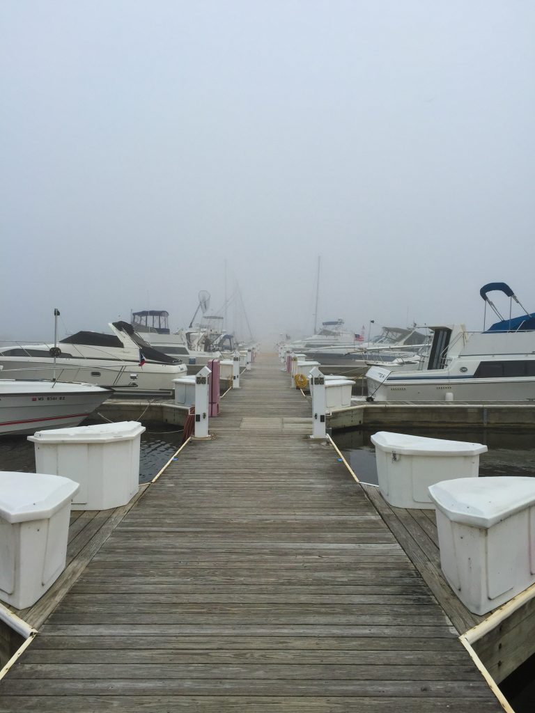 Take Five is docked at the end of the T-dock thirty feet ahead...