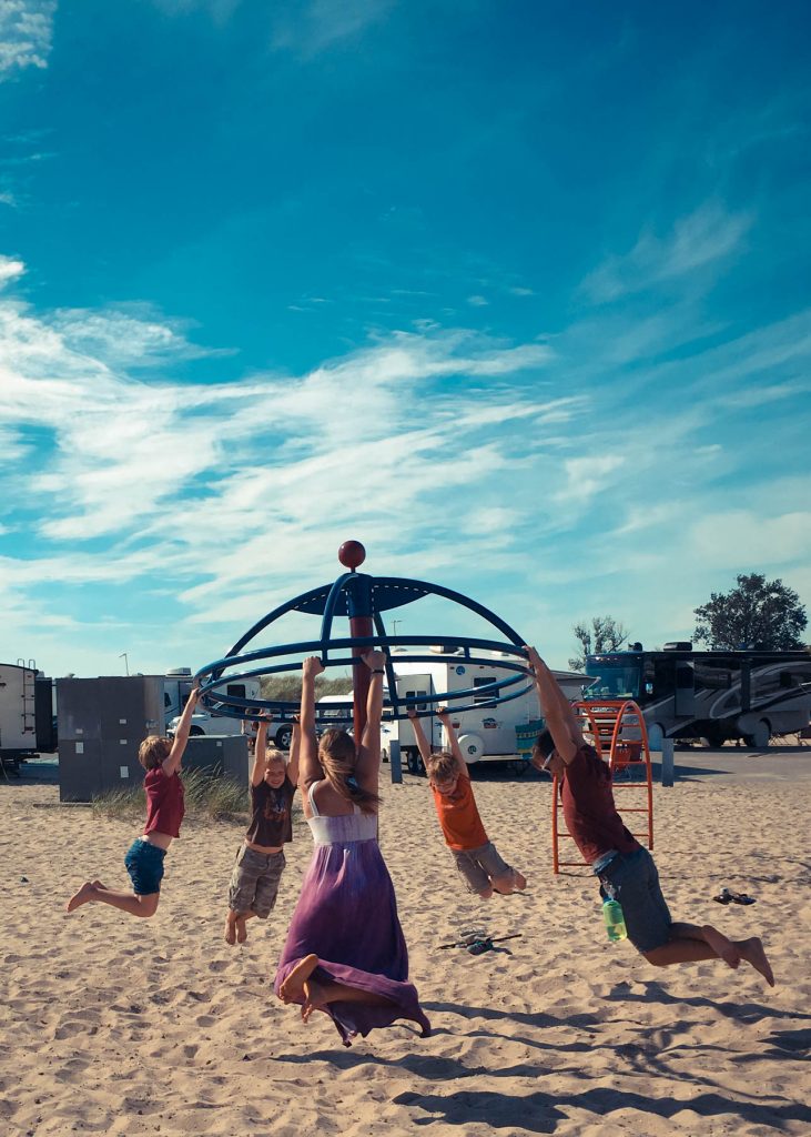 Playing on the beach at Grand Haven State Park